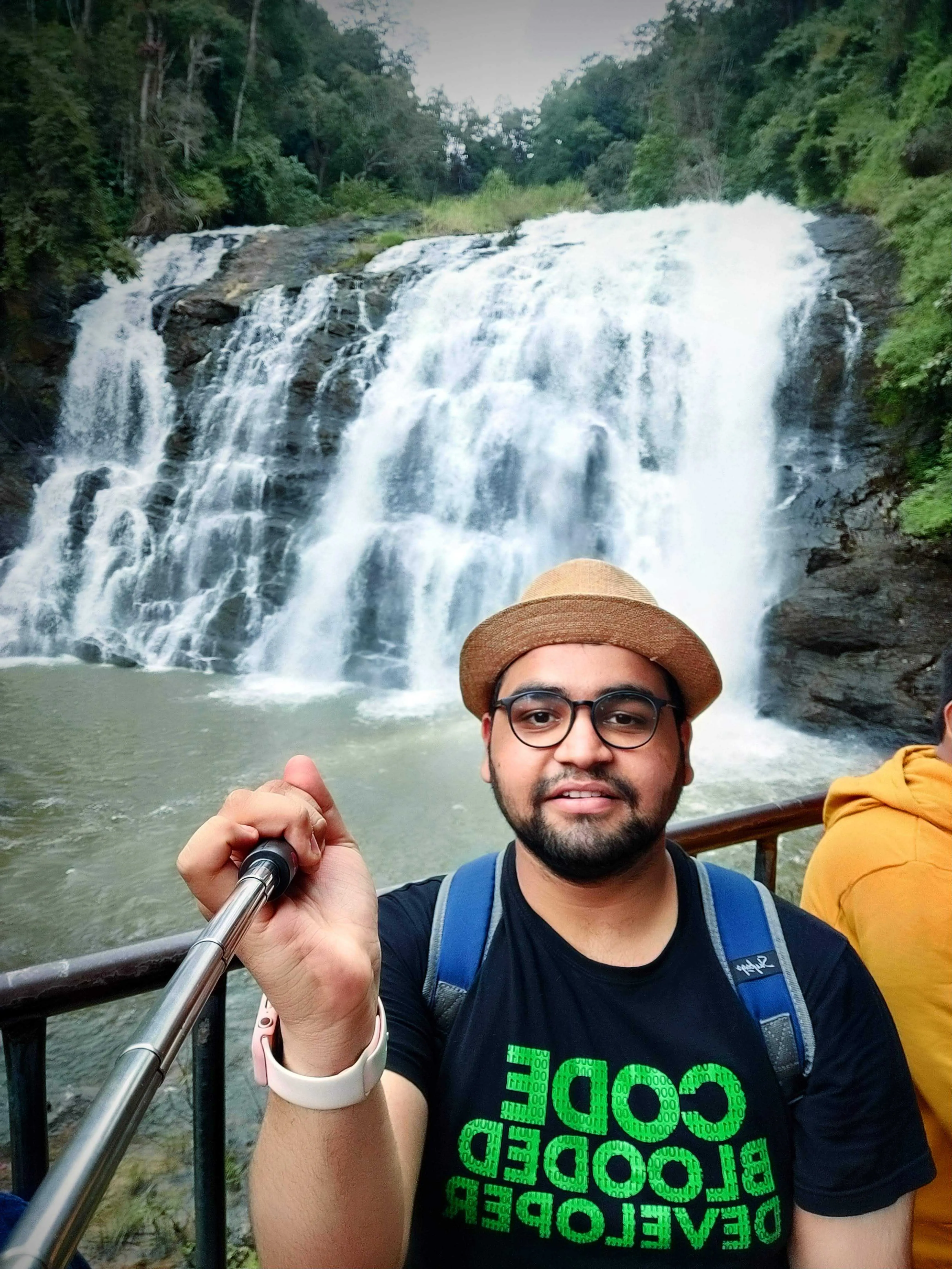 Selfie in front of Abbey Falls, wearing a Code Blooded Developer shirt